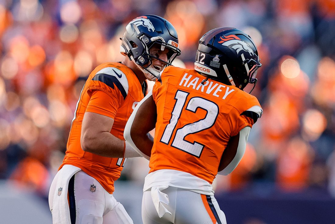 Oct 19, 2025; Denver, Colorado, USA; Denver Broncos quarterback Bo Nix (10) celebrates the touchdown of running back RJ Harvey (12) in the fourth quarter against the New York Giants at Empower Field at Mile High. Mandatory Credit: Isaiah J. Downing-Imagn Images
