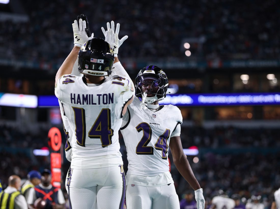 Oct 30, 2025; Miami Gardens, Florida, USA; Baltimore Ravens safety Kyle Hamilton (14) and safety Malaki Starks (24) react after a play during the second quarter against the Miami Dolphins at Hard Rock Stadium.