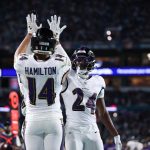 Oct 30, 2025; Miami Gardens, Florida, USA; Baltimore Ravens safety Kyle Hamilton (14) and safety Malaki Starks (24) react after a play during the second quarter against the Miami Dolphins at Hard Rock Stadium.