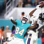 Oct 30, 2025; Miami Gardens, Florida, USA; Baltimore Ravens safety Malaki Starks (24) intercepts a pass intended for Miami Dolphins wide receiver Tahj Washington (84) during the fourth quarter at Hard Rock Stadium. Mandatory Credit: Nathan Ray Seebeck-Imagn Images