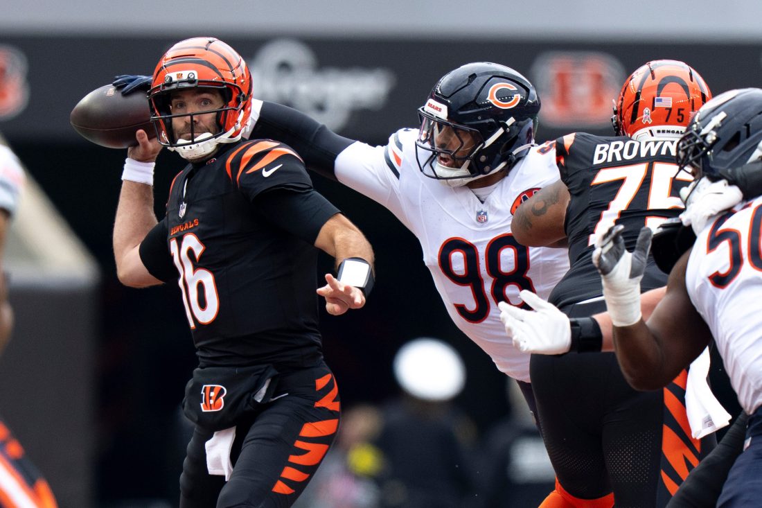 Chicago Bears defensive lineman Montez Sweat (98) deflects a pass attempt by Cincinnati Bengals quarterback Joe Flacco (16) in the second quarter of the NFL football game between Chicago Bears and Cincinnati Bengals at Paycor Stadium in Cincinnati on Nov. 2, 2025.