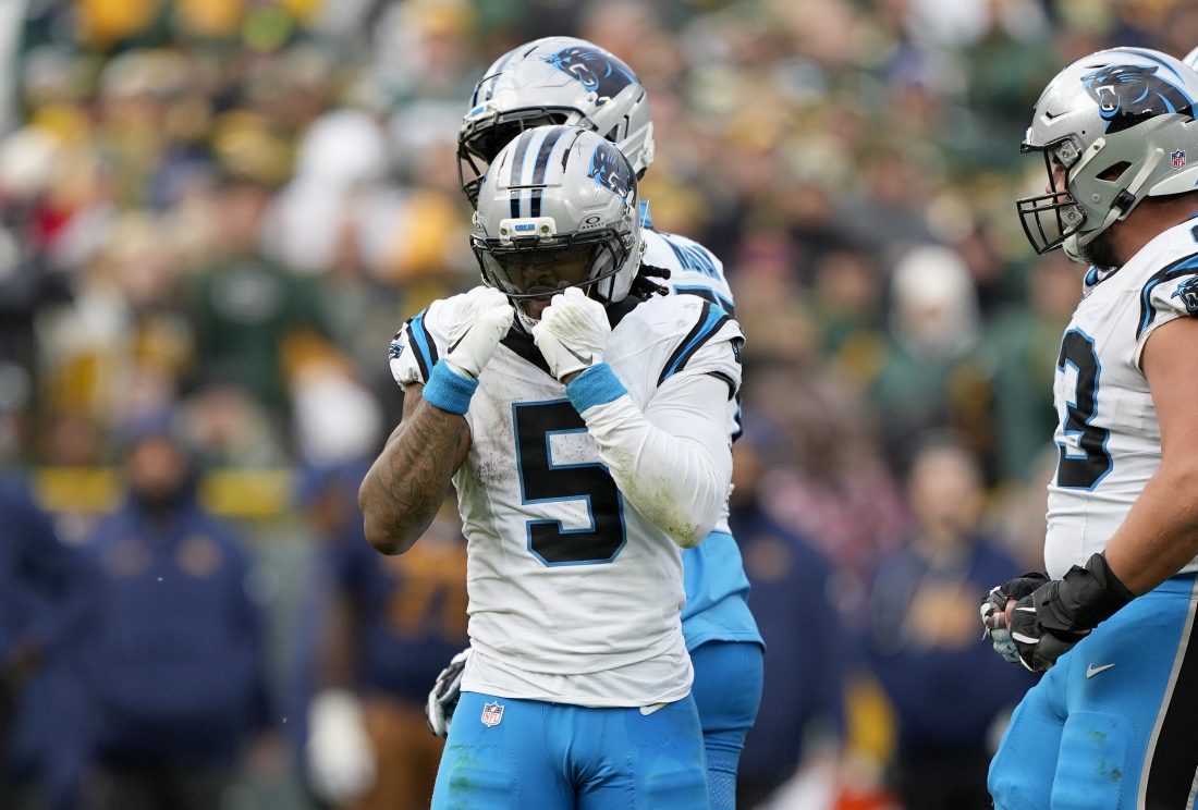 Nov 2, 2025; Green Bay, Wisconsin, USA; Carolina Panthers running back Rico Dowdle (5) celebrates after a first down against the Green Bay Packers during the second half at Lambeau Field.