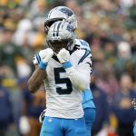 Nov 2, 2025; Green Bay, Wisconsin, USA; Carolina Panthers running back Rico Dowdle (5) celebrates after a first down against the Green Bay Packers during the second half at Lambeau Field.
