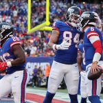 Nov 2, 2025; East Rutherford, New Jersey, USA; New York Giants quarterback Jaxson Dart (6) celebrates his touchdown run with tight end Theo Johnson (84) during the second half at MetLife Stadium. Mandatory Credit: Ed Mulholland-Imagn Images
