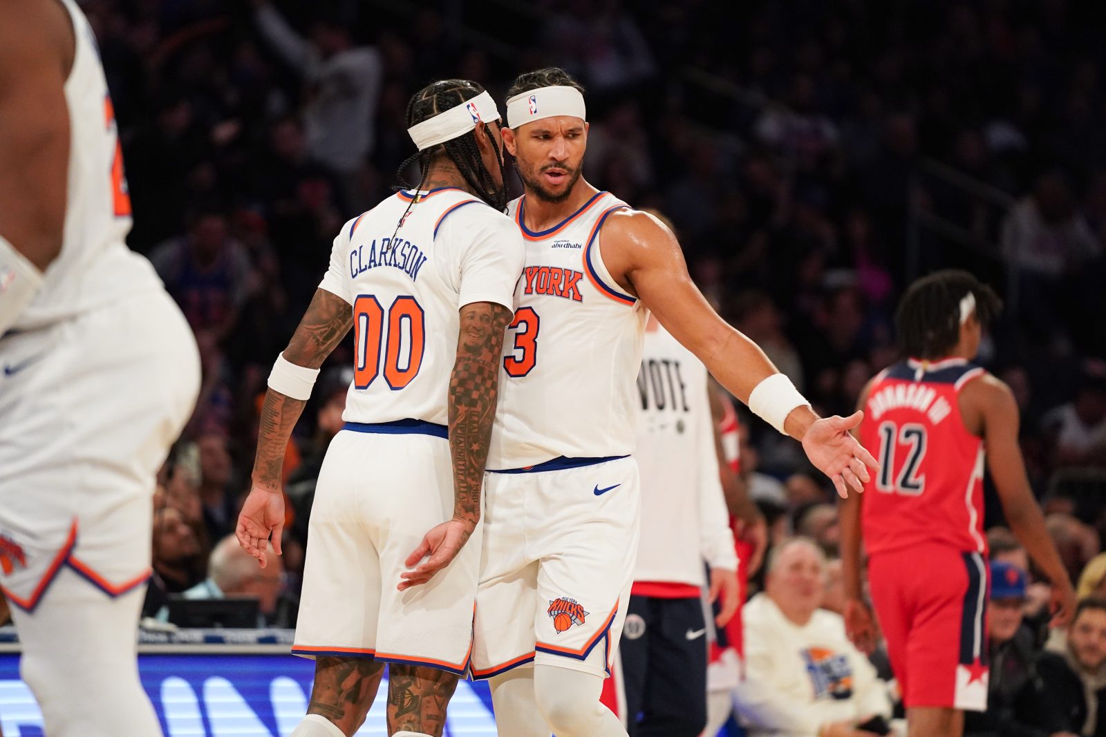 Nov 3, 2025; New York, New York, USA; New York Knicks guard Jordan Clarkson (00) celebrates with New York Knicks guard Josh Hart (3) after scoring a three pointer during the second half against the Washington Wizards at Madison Square Garden. Mandatory Credit: Lucas Boland-Imagn Images