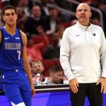 Nov 3, 2025; Houston, Texas, USA; Dallas Mavericks head coach Jason Kidd and forward Dwight Powell (7) watch play against the Houston Rockets the second quarter at Toyota Center.