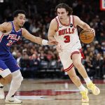 Nov 4, 2025; Chicago, Illinois, USA; Chicago Bulls guard Josh Giddey (3) drives to the basket against Philadelphia 76ers guard Jared McCain (20) during the first half at United Center.