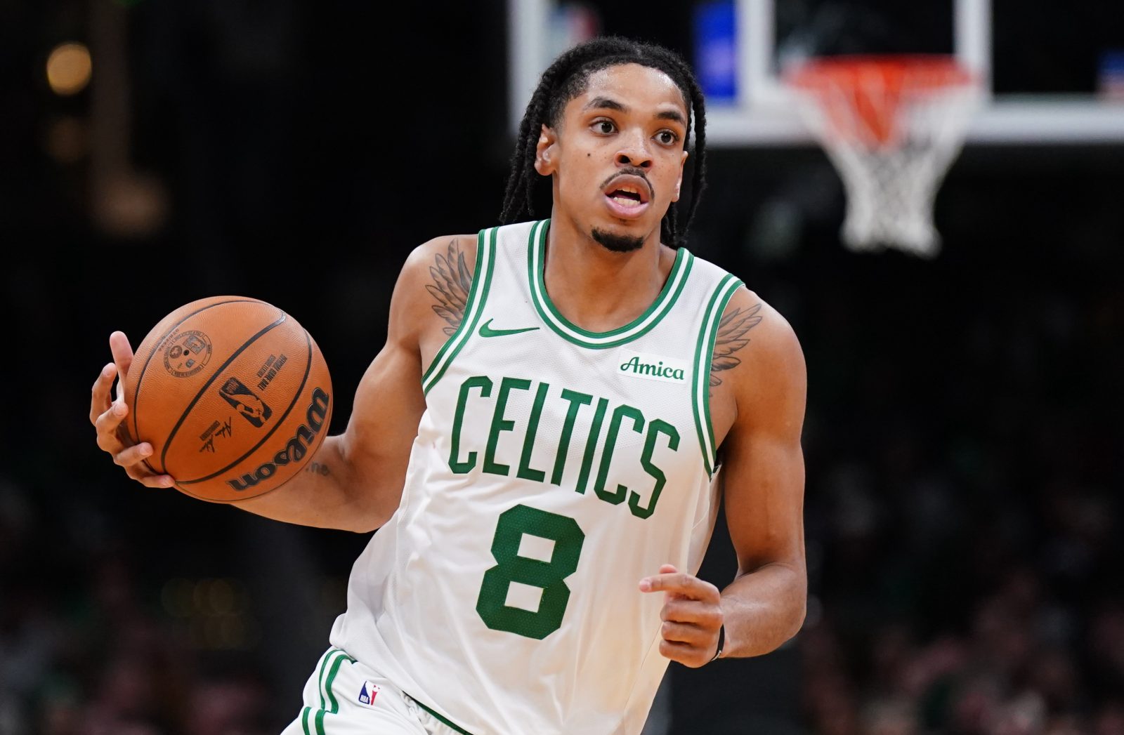 Nov 5, 2025; Boston, Massachusetts, USA; Boston Celtics forward Josh Minott (8) returns the ball against the Washington Wizards in the second half at TD Garden. Mandatory Credit: David Butler II-Imagn Images