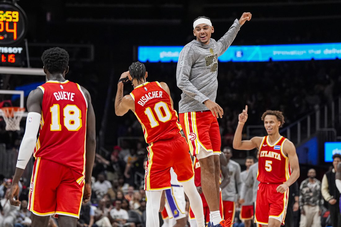 Nov 8, 2025; Atlanta, Georgia, USA; Atlanta Hawks forward Zaccharie Risacher (10) and forward Asa Newell (14) react after a play against the Los Angeles Lakers during the second half at State Farm Arena. Mandatory Credit: Dale Zanine-Imagn Images