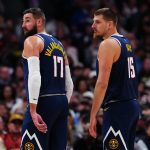 Nov 8, 2025; Denver, Colorado, USA; Denver Nuggets center Jonas Valanciunas (17) and center Nikola Jokic (15) on the court in the second half against the Indiana Pacers at Ball Arena.