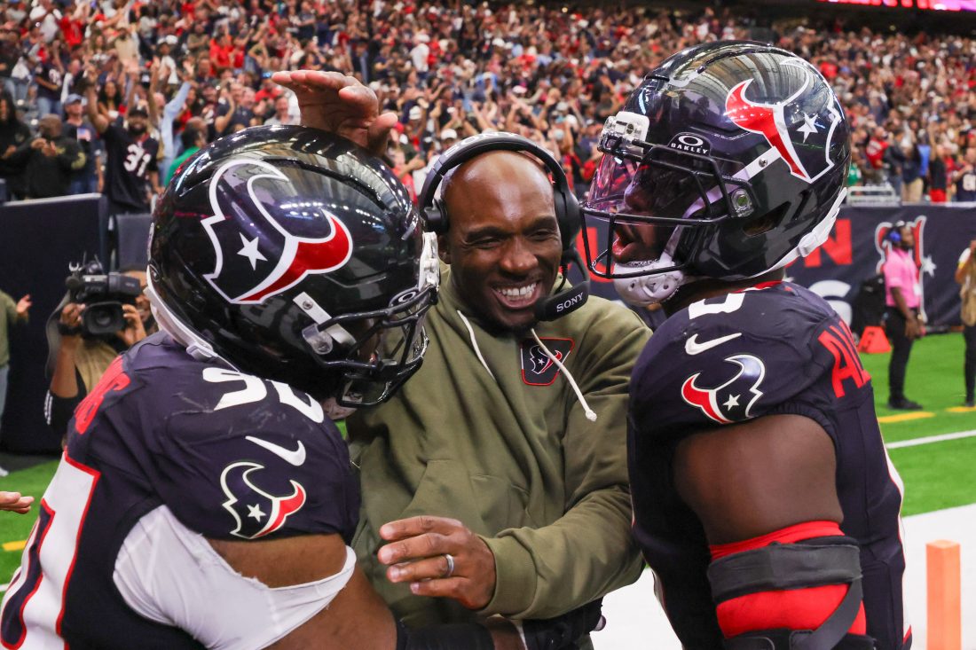 Nov 9, 2025; Houston, Texas, USA; Houston Texans head coach DeMeco Ryans with defensive tackle Sheldon Rankins (90) and linebacker Azeez Al-Shaair (0) following a game against the Jacksonville Jaguars at NRG Stadium. Mandatory Credit: Thomas Shea-Imagn Images
