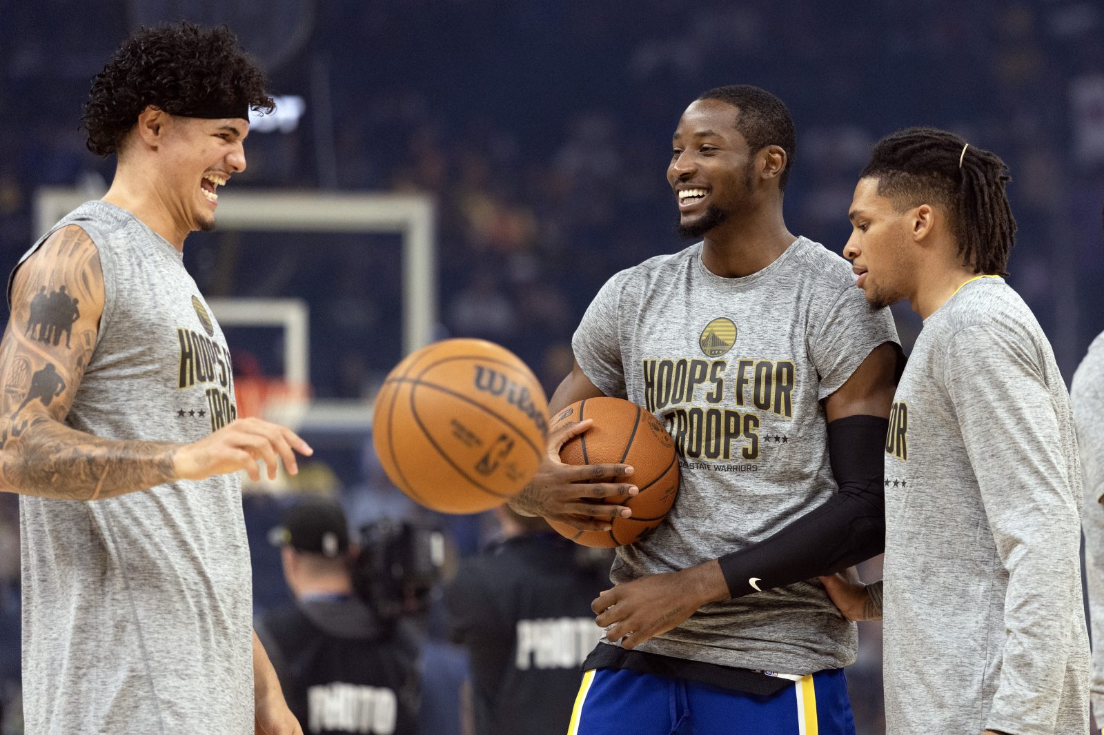 Nov 9, 2025; San Francisco, California, USA; Golden State Warriors players Gui Santos (from left), Jonathan Kuminga and Will Richard warm up before facing the Indiana Pacers at Chase Center. Mandatory Credit: D. Ross Cameron-Imagn Images