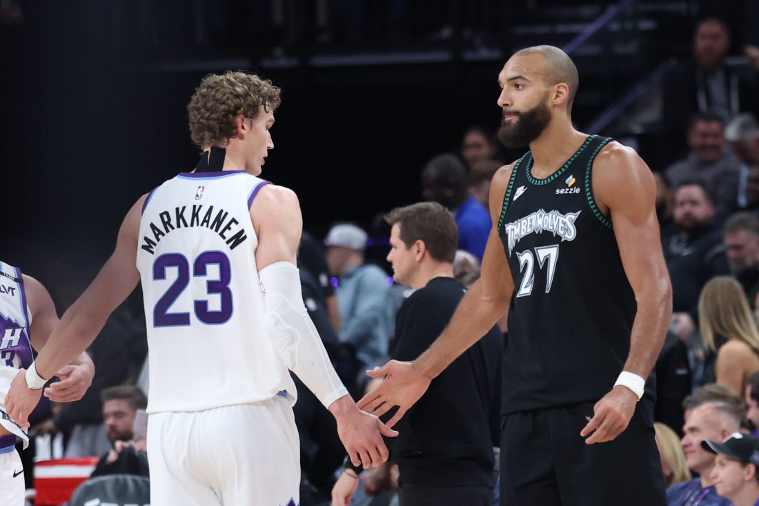 Nov 10, 2025; Salt Lake City, Utah, USA; Utah Jazz forward Lauri Markkanen (23) and Minnesota Timberwolves center Rudy Gobert (27) shake hands after the game at Delta Center. Mandatory Credit: Rob Gray-Imagn Images