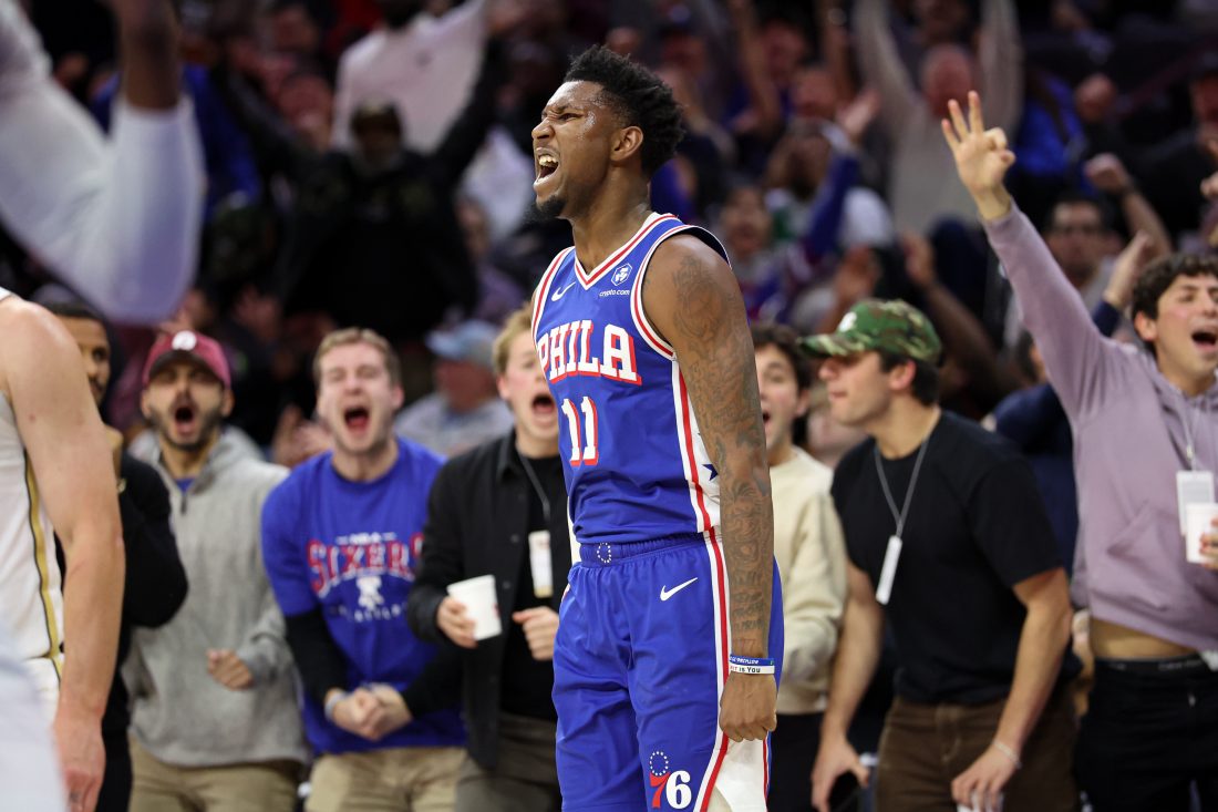 Nov 11, 2025; Philadelphia, Pennsylvania, USA; Philadelphia 76ers forward Justin Edwards (11) reacts after his three pointer during the fourth quarter against the Boston Celtics at Xfinity Mobile Arena. Mandatory Credit: Bill Streicher-Imagn Images