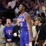 Nov 11, 2025; Philadelphia, Pennsylvania, USA; Philadelphia 76ers forward Justin Edwards (11) reacts after his three pointer during the fourth quarter against the Boston Celtics at Xfinity Mobile Arena. Mandatory Credit: Bill Streicher-Imagn Images