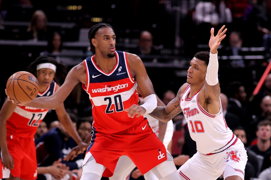 Nov 12, 2025; Houston, Texas, USA; Washington Wizards center Alex Sarr (20) handles the ball against Houston Rockets forward Jabari Smith Jr. (10) during the game at Toyota Center. Mandatory Credit: Erik Williams-Imagn Images