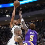 Nov 15, 2025; Milwaukee, Wisconsin, USA; Milwaukee Bucks forward Giannis Antetokounmpo (34) shoots against Los Angeles Lakers center Deandre Ayton (5) during the first quarter at Fiserv Forum.