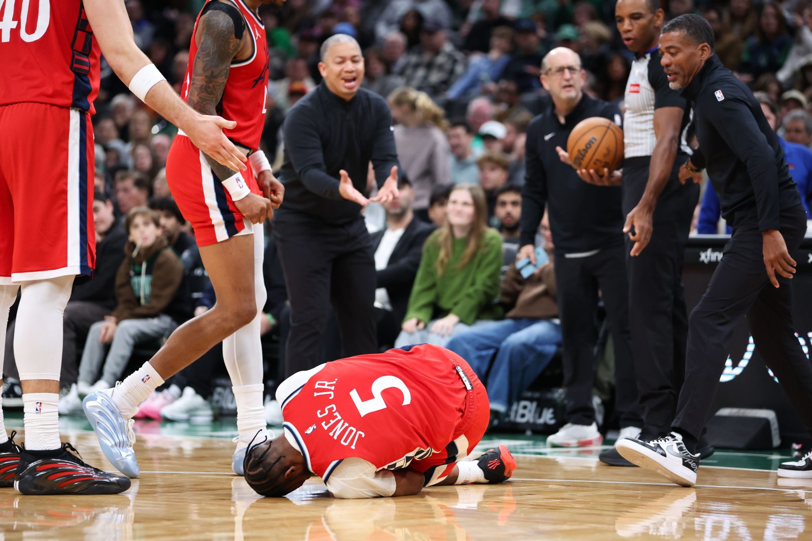 Nov 16, 2025; Boston, Massachusetts, USA; Los Angeles Clippers forward Derrick Jones Jr (5) grabs his knee during the first half against the Boston Celtics at TD Garden. Mandatory Credit: Paul Rutherford-Imagn Images