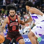 Nov 16, 2025; Salt Lake City, Utah, USA; Chicago Bulls guard Coby White (0) plans his next move against Utah Jazz forward Brice Sensabaugh (28) during the second half at Delta Center. Mandatory Credit: Peter Creveling-Imagn Images