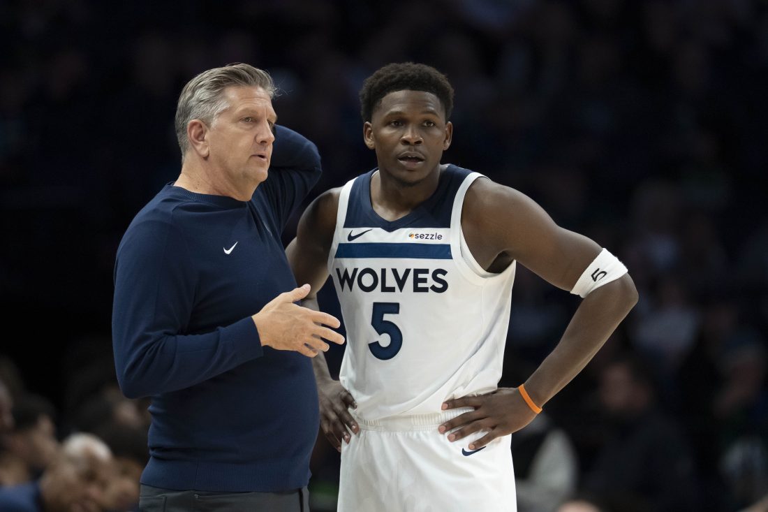 Nov 17, 2025; Minneapolis, Minnesota, USA; Minnesota Timberwolves head coach Chris Finch and Minnesota Timberwolves guard Anthony Edwards (5) looks on against the Dallas Mavericks in the second half at Target Center.