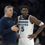 Nov 17, 2025; Minneapolis, Minnesota, USA; Minnesota Timberwolves head coach Chris Finch and Minnesota Timberwolves guard Anthony Edwards (5) looks on against the Dallas Mavericks in the second half at Target Center.
