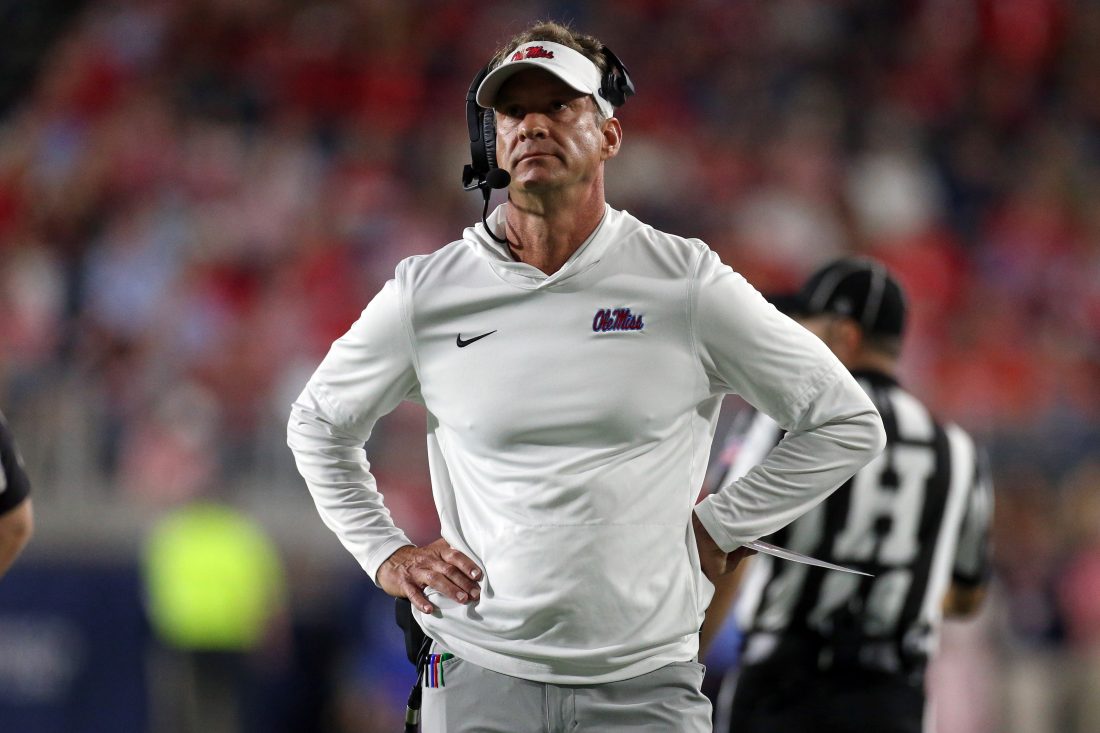 Nov 15, 2025; Oxford, Mississippi, USA; Mississippi Rebels head coach Lane Kiffin looks on during a time out during the first quarter against the Florida Gators at Vaught-Hemingway Stadium. Mandatory Credit: Petre Thomas-Imagn Images