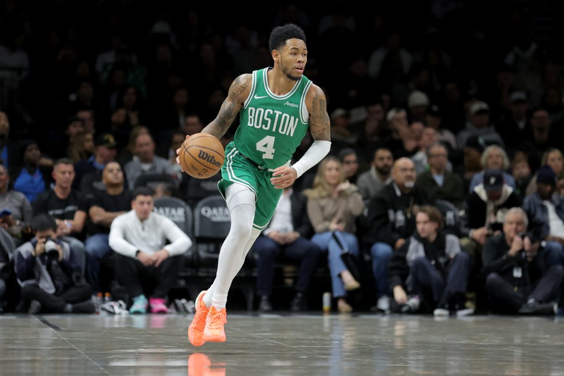 Nov 18, 2025; Brooklyn, New York, USA; Boston Celtics guard Anfernee Simons (4) brings the ball up court against the Brooklyn Nets during the second quarter at Barclays Center. Mandatory Credit: Brad Penner-Imagn Images