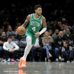 Nov 18, 2025; Brooklyn, New York, USA; Boston Celtics guard Anfernee Simons (4) brings the ball up court against the Brooklyn Nets during the second quarter at Barclays Center. Mandatory Credit: Brad Penner-Imagn Images