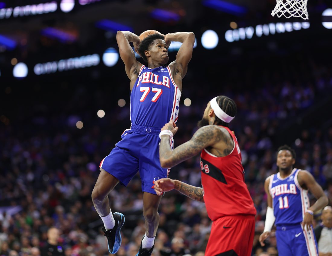 Nov 19, 2025; Philadelphia, Pennsylvania, USA; Philadelphia 76ers guard VJ Edgecombe (77) drives for a dunk in front of Toronto Raptors forward Brandon Ingram (3) during the second quarter at Xfinity Mobile Arena.