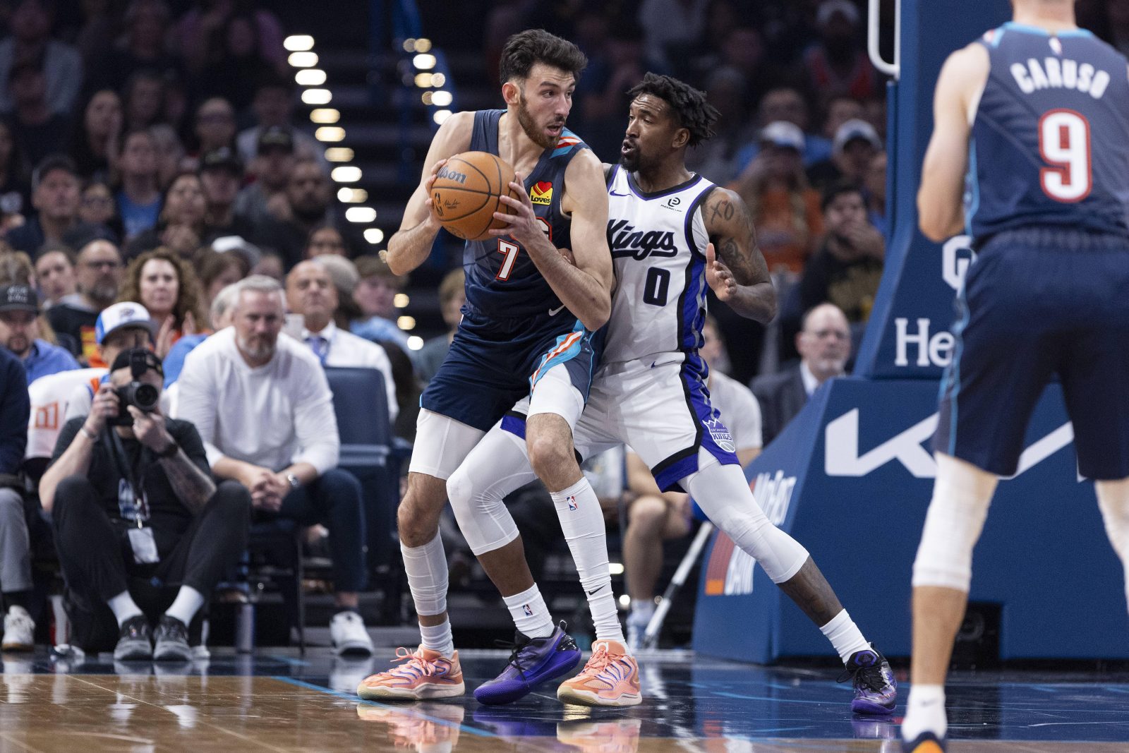 Nov 19, 2025; Oklahoma City, Oklahoma, USA; Oklahoma City Thunder center Chet Holmgren (7) moves the ball towards the basket against Sacramento Kings guard Malik Monk (0) during the second quarter at Paycom Center. Mandatory Credit: Alonzo Adams-Imagn Images
