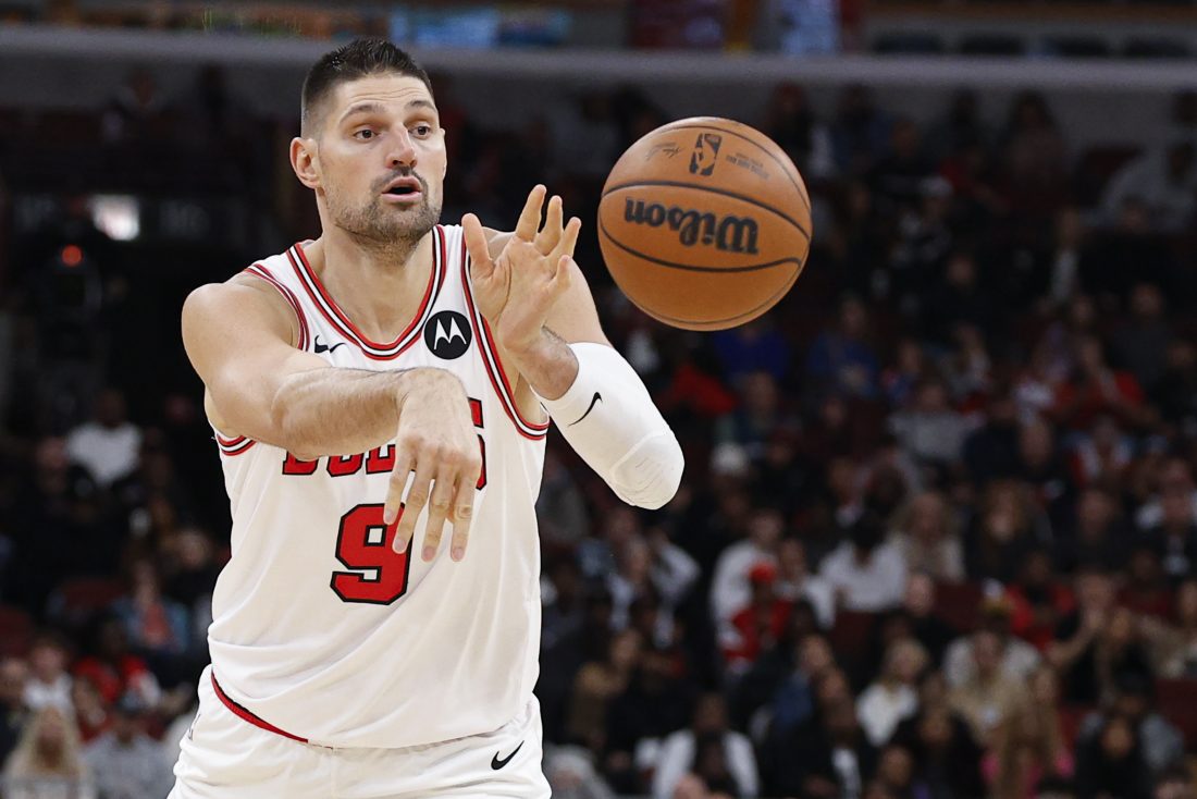 Nov 22, 2025; Chicago, Illinois, USA; Chicago Bulls center Nikola Vucevic (9) passes the ball against the Washington Wizards during the first half at United Center.