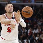 Nov 22, 2025; Chicago, Illinois, USA; Chicago Bulls center Nikola Vucevic (9) passes the ball against the Washington Wizards during the first half at United Center.