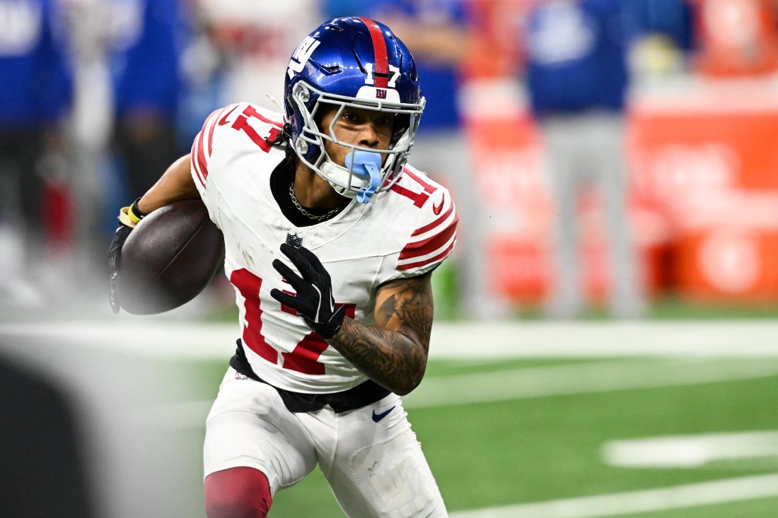 Nov 23, 2025; Detroit, Michigan, USA; New York Giants wide receiver Wan'Dale Robinson (17) runs upfield after catching a swing pass in the second quarter against the Detroit Lions at Ford Field.