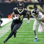 Nov 23, 2025; New Orleans, Louisiana, USA; New Orleans Saints running back Devin Neal (24) carries the ball as Atlanta Falcons linebacker Kaden Elliss (55) defends during the second half at Caesars Superdome.