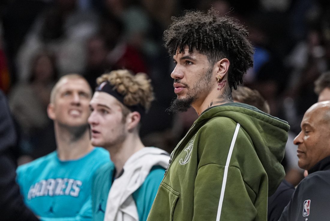 Nov 23, 2025; Atlanta, Georgia, USA; Charlotte Hornets injured guard LaMelo Ball (1) shown on the bench against the Atlanta Hawks during the second half at State Farm Arena. Mandatory Credit: Dale Zanine-Imagn Images