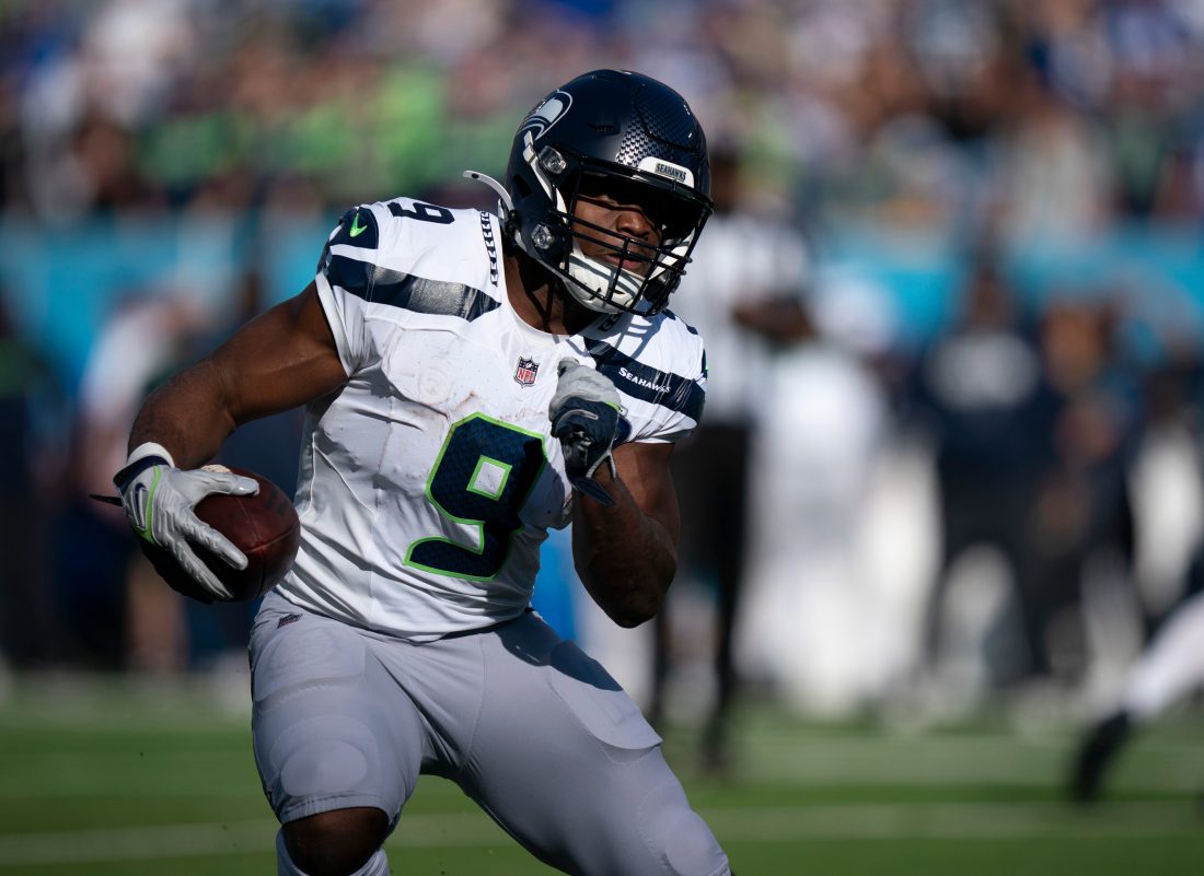 Seattle running back Kenneth Walker III (9) runs against Tennessee during their game at Nissan Stadium Sunday, Nov. 23, 2025.
