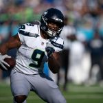 Seattle running back Kenneth Walker III (9) runs against Tennessee during their game at Nissan Stadium Sunday, Nov. 23, 2025.