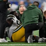 Nov 27, 2025; Detroit, Michigan, USA; Green Bay Packers defensive tackle Devonte Wyatt (95) is looked at after an injury against the Detroit Lions during the third quarter at Ford Field. Mandatory Credit: Lon Horwedel-Imagn Images