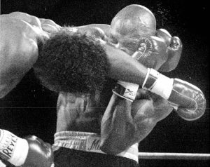 Thomas Hearns loops a left that slides off Marvin Hagler's glove in the first round of their bout in 1985 in Las Vegas. Credit: Mary Schroeder, Special to the Free Press
