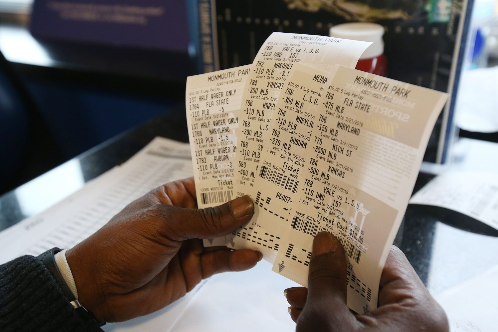 Charlie Rogers of Aberbeen, a former NFL player, displays his betting slips during March Madness, the NCAA menâ€™s college basketball tournament, at Monmouth Park's William Hill Race and Sports Bar in Oceanport, NJ Thursday March 21, 2019. Hill07 Charlie Rogers of Aberbeen, a former NFL player, displays his betting slips during March Madness, the NCAA menaTMs college basketball tournament, at Monmouth Park's William Hill Race and Sports Bar in Oceanport, NJ Thursday March 21, 2019.