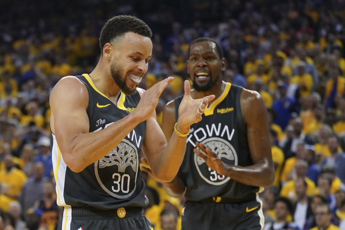 April 30, 2019; Oakland, CA, USA; Golden State Warriors guard Stephen Curry (30) and forward Kevin Durant (35) react against the Houston Rockets during the second quarter in game two of the second round of the 2019 NBA Playoffs at Oracle Arena. Mandatory Credit: Kyle Terada-USA TODAY Sports