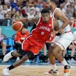 Jul 27, 2024; Villeneuve-d'Ascq, France; Japan small forward Rui Hachimura (8) pushes past Germany power forward Johannes Thiemann (32) during the Paris 2024 Olympic Summer Games at Stade Pierre-Mauroy.