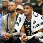 Nov 12, 2024; Milwaukee, Wisconsin, USA; Milwaukee Bucks forward Giannis Antetokounmpo (34) sits with guard Damian Lillard on the bench during the fourth quarter against the Toronto Raptors at Fiserv Forum. Mandatory Credit: Jeff Hanisch-Imagn Image