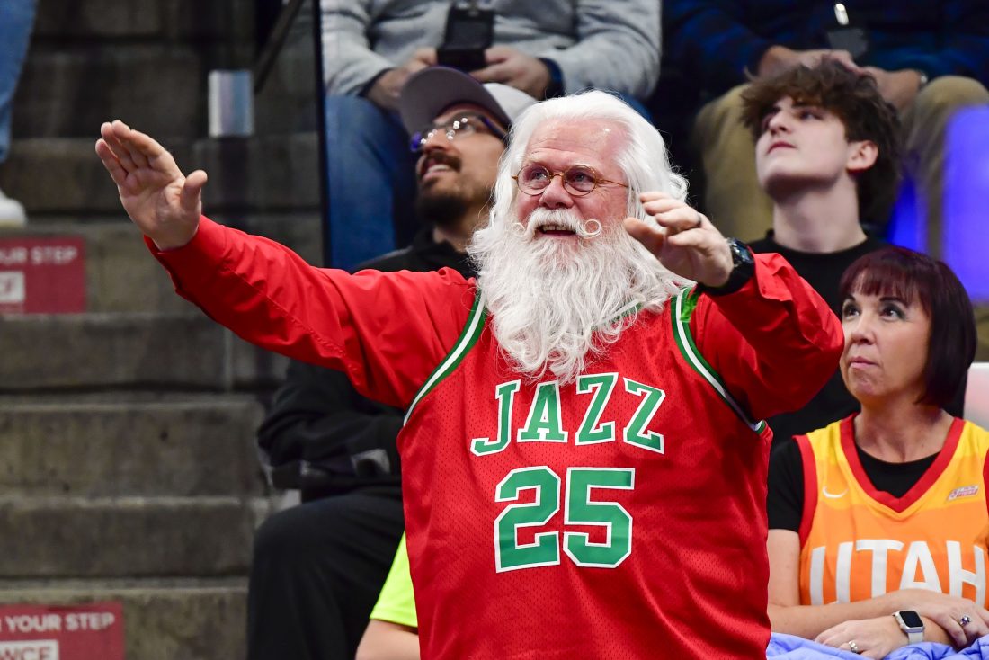 Nov 27, 2024; Salt Lake City, Utah, USA; A Utah Jazz fan in Christmas colors is seen against the Denver Nuggets during the second half at the Delta Center. Mandatory Credit: Christopher Creveling-Imagn Images