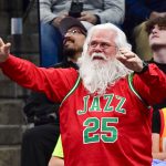 Nov 27, 2024; Salt Lake City, Utah, USA; A Utah Jazz fan in Christmas colors is seen against the Denver Nuggets during the second half at the Delta Center. Mandatory Credit: Christopher Creveling-Imagn Images