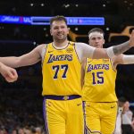 Feb 10, 2025; Los Angeles, California, USA; Los Angeles Lakers guard Luka Doncic (77) and guard Austin Reaves (15) react after a basket against the Utah Jazz at Crypto.com Arena. Mandatory Credit: Jayne Kamin-Oncea-Imagn Images
