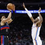 Mar 15, 2025; Detroit, Michigan, USA; Detroit Pistons guard Cade Cunningham (2) shoots on Oklahoma City Thunder guard Shai Gilgeous-Alexander (2) in the first half at Little Caesars Arena.