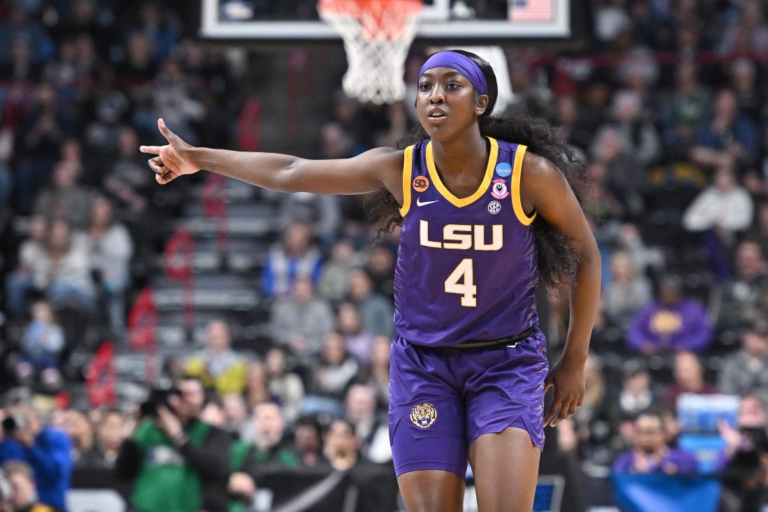 Mar 30, 2025; Spokane, WA, USA; LSU Lady Tigers guard Flau'Jae Johnson (4) reacts after play against the UCLA Bruins during the first half of a Elite 8 NCAA Tournament basketball game at Spokane Arena. Mandatory Credit: James Snook-Imagn Images