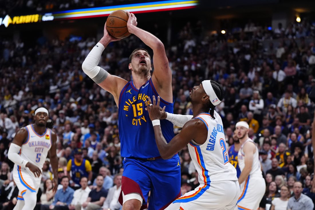May 9, 2025; Denver, Colorado, USA; Oklahoma City Thunder guard Shai Gilgeous-Alexander (2) defends on Denver Nuggets center Nikola Jokic (15) in the second half during game three of the second round for the 2025 NBA Playoffs at Ball Arena.