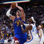 May 9, 2025; Denver, Colorado, USA; Oklahoma City Thunder guard Shai Gilgeous-Alexander (2) defends on Denver Nuggets center Nikola Jokic (15) in the second half during game three of the second round for the 2025 NBA Playoffs at Ball Arena.